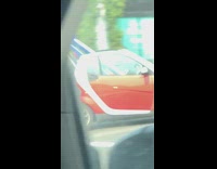 Collab Kook Of The Day - Two surfboards stick out red convertible car 