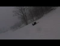 Snowboarder falls from wind 