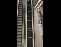Up escalator is missing metal steps