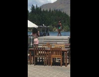 Woman black top spin whip hair wharf