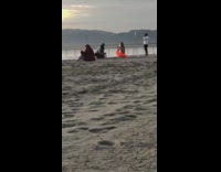 Woman bonnet slap conga drum orange beach