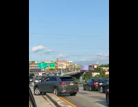 Collab WINY - Gray Car stuck tries to get over highway divider