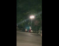 Woman red pants lamp post pictorial nighttime