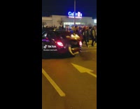 Car Revs then Man Hits Plastic Bottle on Ground