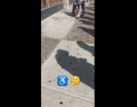 man walks while sitting on wheelchair