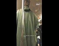 Man green poncho subway singing thanksgiving turkey song