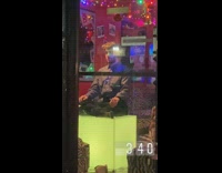 Karaoke employee stands still 