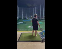 Boy throws golf club at topgolf 