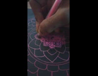 Gel pen art with pink ink on black piece of paper 
