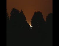 Red sky from wildfires fires guy car