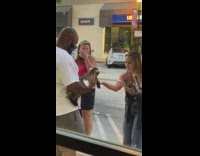 Man white shirt holds baby goat sidewalk photoshoot