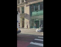 Lady asks guy riding bicycle if ball is stuck on head 