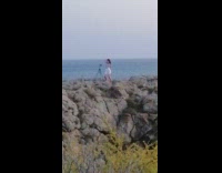 White skirt girl tiktok dances rock cliff 