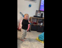 Dad playing baseball with toddler 