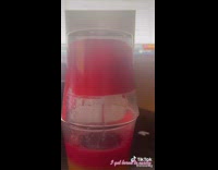 Two red candles on top of each other lit 