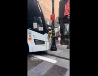 Bus blocking the road crashed to building