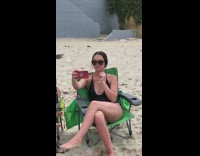 Girl green chair beach sand selfie kid 
