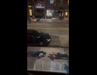 Two guys push ups on the sidewalk