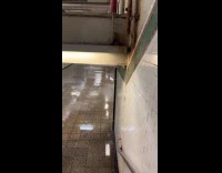 Rain leaks inside subway station during storm