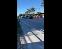 Police rides bike and cars on road