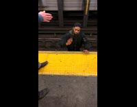 Man jumps from tracks to platform