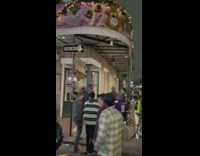 People wandering the streets during mardi gras