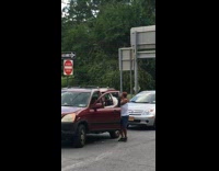 Girl stops red car dances causes traffic 