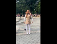 Woman dressed as Megan roams around park