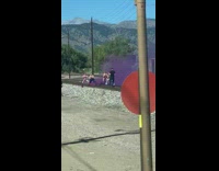 Four women exercise outfit violet smoke bomb railroad