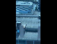 Person twerks for video shoot on rooftop