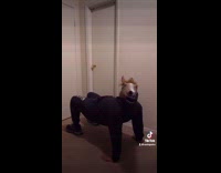 Guy does yoga position wearing horse head 
