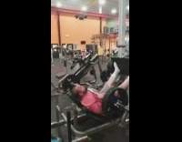 Guy works out on leg press and bench press at the gym
