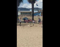 Girl gray yoga pants lie down table beach 