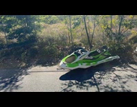 Jet ski and mattress on the sidewalk