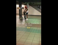 Man takes off pants and irons them on ironing board in subway station