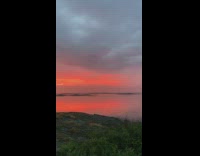 Sunset ocean water red sky white cloud 