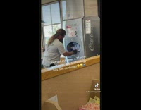 Guy trying to figure out new soda machine 