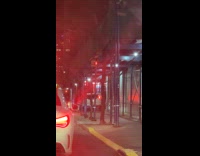 Car drives on sidewalk to avoid traffic