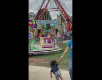 Woman yellow top on tea cup ride for photoshoot