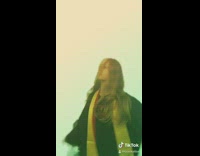 Two girls lip sync dance graduation gowns 