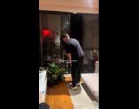 Man spits water to water the plants