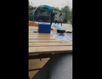 Three girls film dance tiktok wooden table