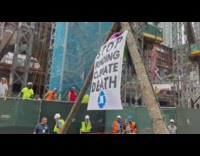 Activists tied to metal structure 