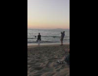 Lady shoes in hand sunset white pants 