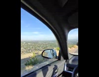 Filmer drives car on high mountain road