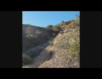 Slow motion guy crashes  on his bike behind friend