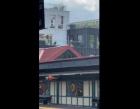 Women fillip up pool with bowls of water