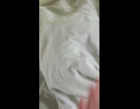 Blanket pushed softly and cat inside meows 