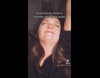 Drunk woman hanging on bathroom stall