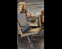 Collab IITW - Woman grey shirt dance practice at airport